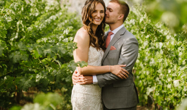 Bride and groom in a fruit orchard